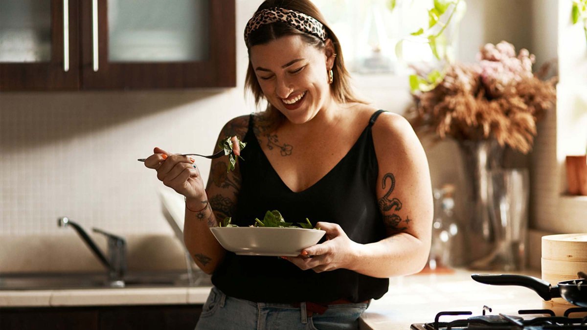 Girl laughing and eating