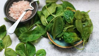 Salmon and cauliflower fishcakes with pea, spinach and asparagus salad